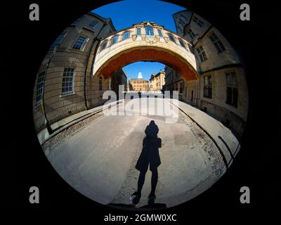 Oxford, England - July 2021; One cyclist in view. Linking two parts of Hertford College, Oxford, its landmark Hertford Bridge - often dubbed The Bridg Stock Photo