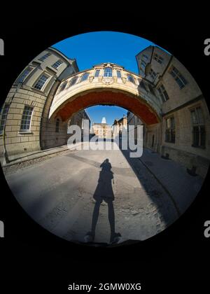 Oxford, England - July 2021; One cyclist in view. Linking two parts of Hertford College, Oxford, its landmark Hertford Bridge - often dubbed The Bridg Stock Photo