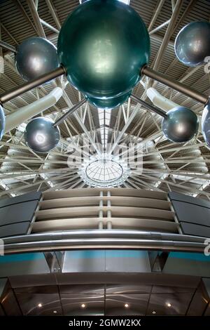 Futuristic architecture with concrete and glass interlocked triangular ...
