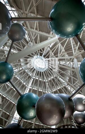Futuristic architecture with concrete and glass interlocked triangular ...