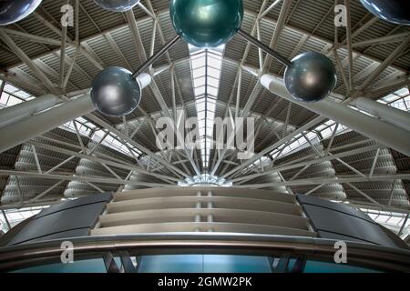 Futuristic architecture with concrete and glass interlocked triangular ...