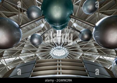 Futuristic architecture with concrete and glass interlocked triangular ...