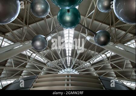 Futuristic architecture with concrete and glass interlocked triangular ...
