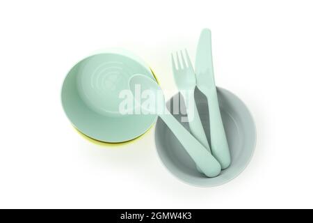 Colorful plastic dishware isolated on white background Stock Photo