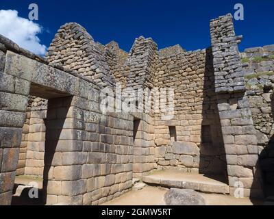 Machu Picchu, Peru - 14 May 2018 Set in an awe-inspiring mountainous location at 2400m elevation in the Andes, the ruins of the 15th Century Inca City Stock Photo