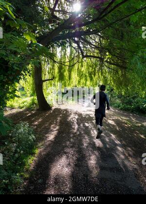 Abingdon, England - 4 May 2019; one man in shot.  This beautiful footpath runs through Abbey Fields in Abingdon, England. Named after the medieval abb Stock Photo