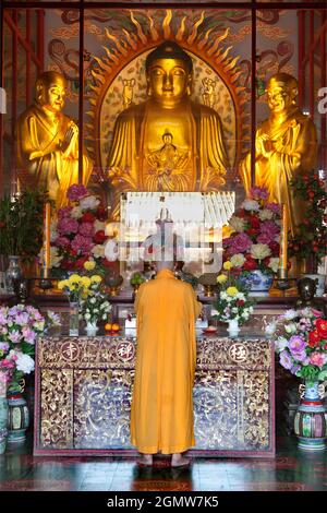 Penang, Malaysia - 7 April 2011; one monk in view. Overlooking the sea, Kek Lok Si (Heavenly Temple) on Penang Island , is the largest Buddhist Temple Stock Photo