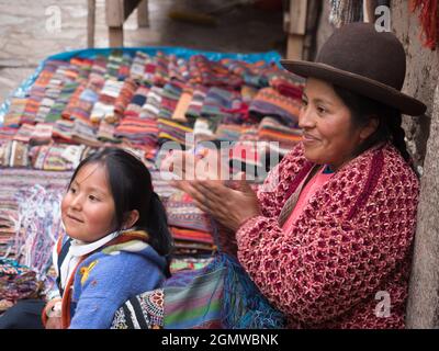 Pisac, Peru - 11 May 2018; a mother and child in shot  A happy family scene in Pisac market, close to Cusco, Peru. Stock Photo