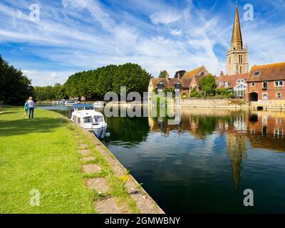 Abingdon, England - 12 July 2020; Two people in shot. Saint Helen's Wharf is a noted beauty spot on the River Thames, just upstream of the medieval br Stock Photo