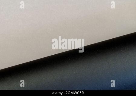 Two-color multitasking background. Gray-black surface. Top view. Stock Photo