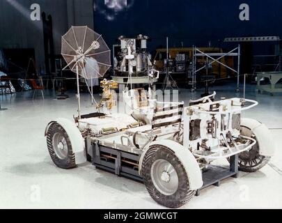 The Lunar Roving Vehicle (LRV) was designed to transport astronauts and materials on the Moon. It was a collapsible open-space vehicle about 10 feet long with large mesh wheels, anterna, appendages, tool caddies, and cameras. Powered by two 36-volt batteries, it has four 1/4-hp drive motors, one for each wheel. The vehicle was designed to travel in forward or reverse, negotiate obstacles about 1 foot high, cross crevasses about 2 feet wide, and climb or descend moderate slopes. Its speed limit was about 9 miles (14 kilometers) per hour. An LRV was used on each of the last three Apollo missions Stock Photo