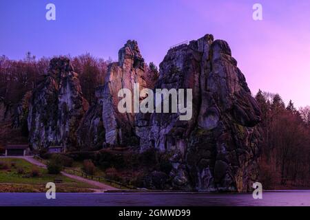 Externsteine at pink sunset, Germany Stock Photo