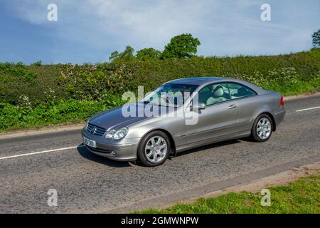 2003 silver Mercedes Benz CLK CLK320 AVANTGARDE, 5 speed automatic en-route to Capesthorne Hall classic May car show, Cheshire, UK Stock Photo