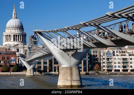 London, England - 2011; Here are two great landmarks by the Thames in London - old and new in contrast.  St Paul's Anglican Cathedral, dating from the Stock Photo