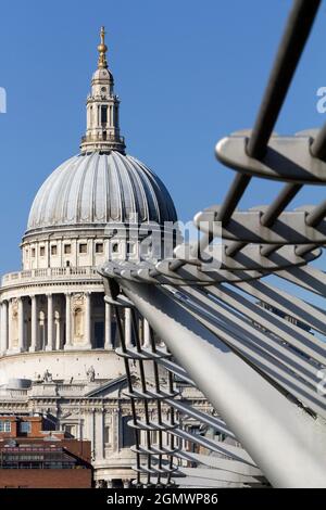 London, England - 2011; Here are two great landmarks by the Thames in London - old and new in contrast.  St Paul's Anglican Cathedral, dating from the Stock Photo