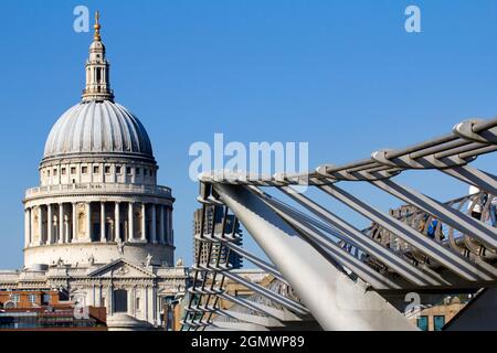 London, England - 2011; Here are two great landmarks by the Thames in London - old and new in contrast.  St Paul's Anglican Cathedral, dating from the Stock Photo