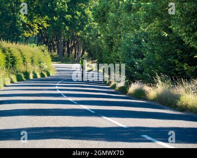 Radley Village, Oxfordshire, England - 25 June 2020; one person, bike riding, in view.     What to do during the pandemic lockdown? Well, my daily (al Stock Photo