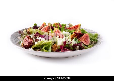 Figs salad with cheese and walnuts isolated on white background Stock Photo