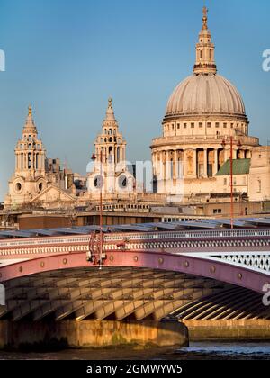 London, England - 2011; Here are two great landmarks by the Thames in London - old and new in contrast.  St Paul's Anglican Cathedral, dating from the Stock Photo