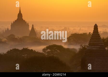 Bagan, Myanmar - 29 January 2013.  Glowing sunrise over the pagodas of the Bagan Valley in Mandalay, Myanmar. From the 9th to 13th centuries, the city Stock Photo
