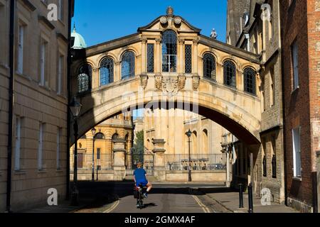 Oxford, England - 7 August 2020; One cyclist in view.   Linking two parts of Hertford College, Oxford, its landmark Hertford Bridge - often dubbed The Stock Photo