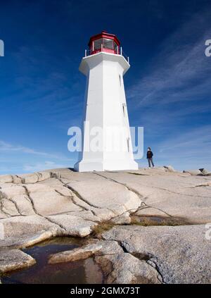 Peggy's Cove, Nova Scotia, Canada - 11 October 2013; one tourists in shot.  Peggy's Cove is a tiny, quaint fishing village located on the eastern shor Stock Photo