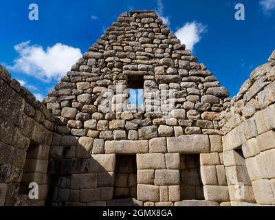 Machu Picchu, Peru - 14 May 2018 Set in an awe-inspiring mountainous location at 2400m elevation in the Andes, the ruins of the 15th Century Inca City Stock Photo