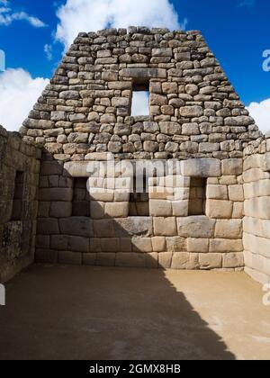 Machu Picchu, Peru - 14 May 2018 Set in an awe-inspiring mountainous location at 2400m elevation in the Andes, the ruins of the 15th Century Inca City Stock Photo