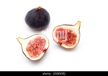 Pieces, slices of ripple figs isolated on white, top view, space for text Stock Photo
