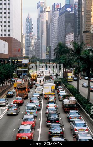 Hong Kong - February 2106; Traffic jam in the street canyons of Hong Kong Island, flanked by skyscrapers and facing Hong Kong's Victoria Harbour. Stock Photo