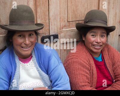 Pisac, Peru - 11 May 2018; two women in shot   Portrait of an old woman in Pisac market, close to Cusco, Peru. Like may women in the area, they wear h Stock Photo