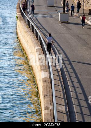 Paris, France - 20  September , 2018 Several people in shot.    The River Seine and its collection of scenic bridges are one of the highlights of any Stock Photo