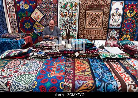 Wheatley, Oxfordshire, UK -  July 2012;  Artisan selling Turkish carpets at an Arts Festival in Wheatley, Oxfordshire. And he's having a good sow whil Stock Photo