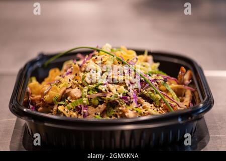 Penne pasta in tomato sauce and cheese decorated with basil on a wooden background, top view Stock Photo