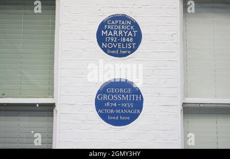 Blue commemorative plaques dedicated to Captain Frederick Marryat, Novelist, and George Grossmith, Actor Manager.
