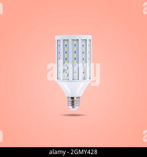 LED energy saving lamp 230v isolated on orange pastel color background Stock Photo