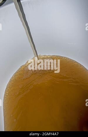 Low quality of tap water. The reason why it makes sense to install tap water filter. Stock Photo