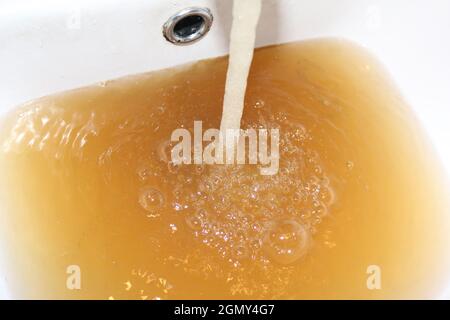 Low quality of tap water. The reason why it makes sense to install tap water filter. Stock Photo