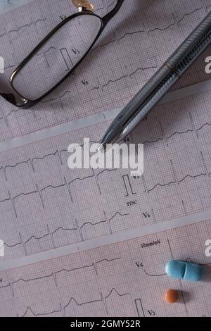Desk of a doctor. Elements that a cardiologist uses in his work. Patient study material. Stock Photo