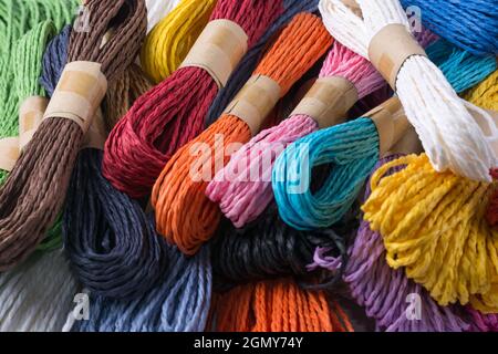 paper yarn strings, colorful weaving, knitting and craft materials, closeup view Stock Photo