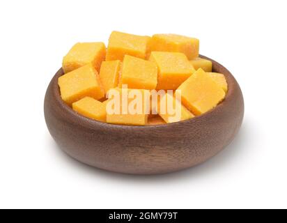 Wooden bowl of candied mango dice isolated on white Stock Photo