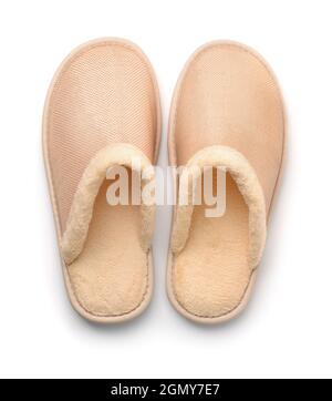 Top view of soft beige home slippers isolated on white Stock Photo