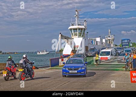 The Sandbanks Ferry with cars disembarking at the Shell Bay Terminal at Studland, Dorset in England. Stock Photo