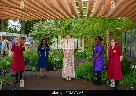 Chelsea, London, UK. 20th September, 2021. Actress and star of Call the Midwife, Helen George and her boyfriend Jack Ashton joined a group of Nightingale nurses in the Florence Nightingale Garden. She read out a poem entitled I Speak for Nurses Worldwide. Helen is expecting a baby which is due in December. Credit: Maureen McLean/Alamy Stock Photo