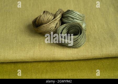 Embroidery kit. Green linen fabrics and threads. Home crafts, embroidery Stock Photo