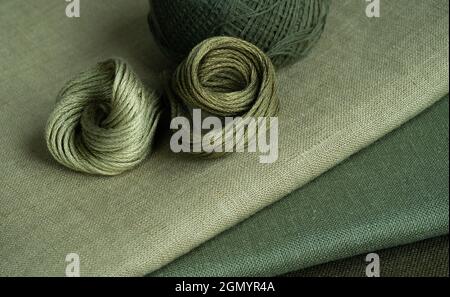 Embroidery kit. Green linen fabrics and threads. Home crafts, embroidery Stock Photo