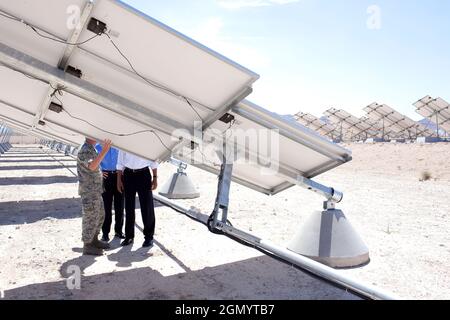 President Barack Obama views solar panels during a tour of the Photovoltaic Array at Nellis Air Force Base in Las Vegas with Sen. Harry Reid and Col. Howard Belote, base commander, May 27, 2009.  (Official White House photo by Pete Souza) This official White House photograph is being made available for publication by news organizations and/or for personal use printing by the subject(s) of the photograph. The photograph may not be manipulated in any way or used in materials, advertisements, products, or promotions that in any way suggest approval or endorsement of the President, the First Famil Stock Photo