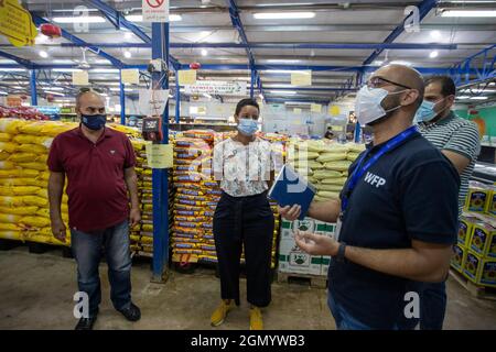 Minister for Development Cooperation Meryame Kitir (C) pictured during a visit to the Tazweed Supermarket (WFP) where a monthly food assistance to ref Stock Photo