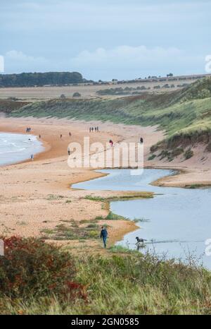 Visitors on the beach at Embleton Bay, Embleton, Northumberland, England, UK Stock Photo