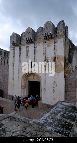 5th Sep 21, Golkonda fort, Hyderabad, India. Tourists at Bala Hissar Gate or Darwaza, the main entrance to Golconda fort. It has a pointed arch border Stock Photo